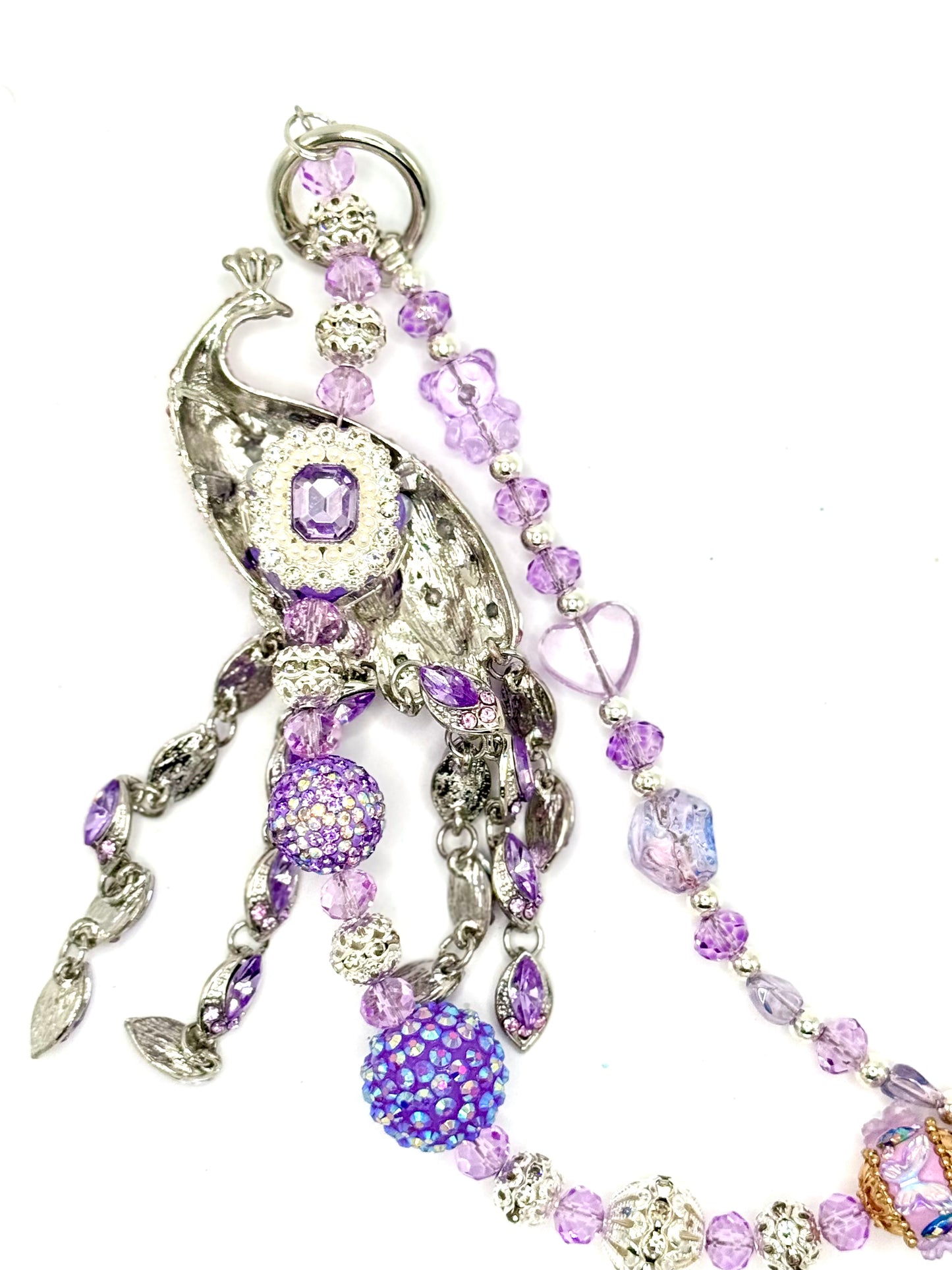 Purple peacock charmed phone chain.