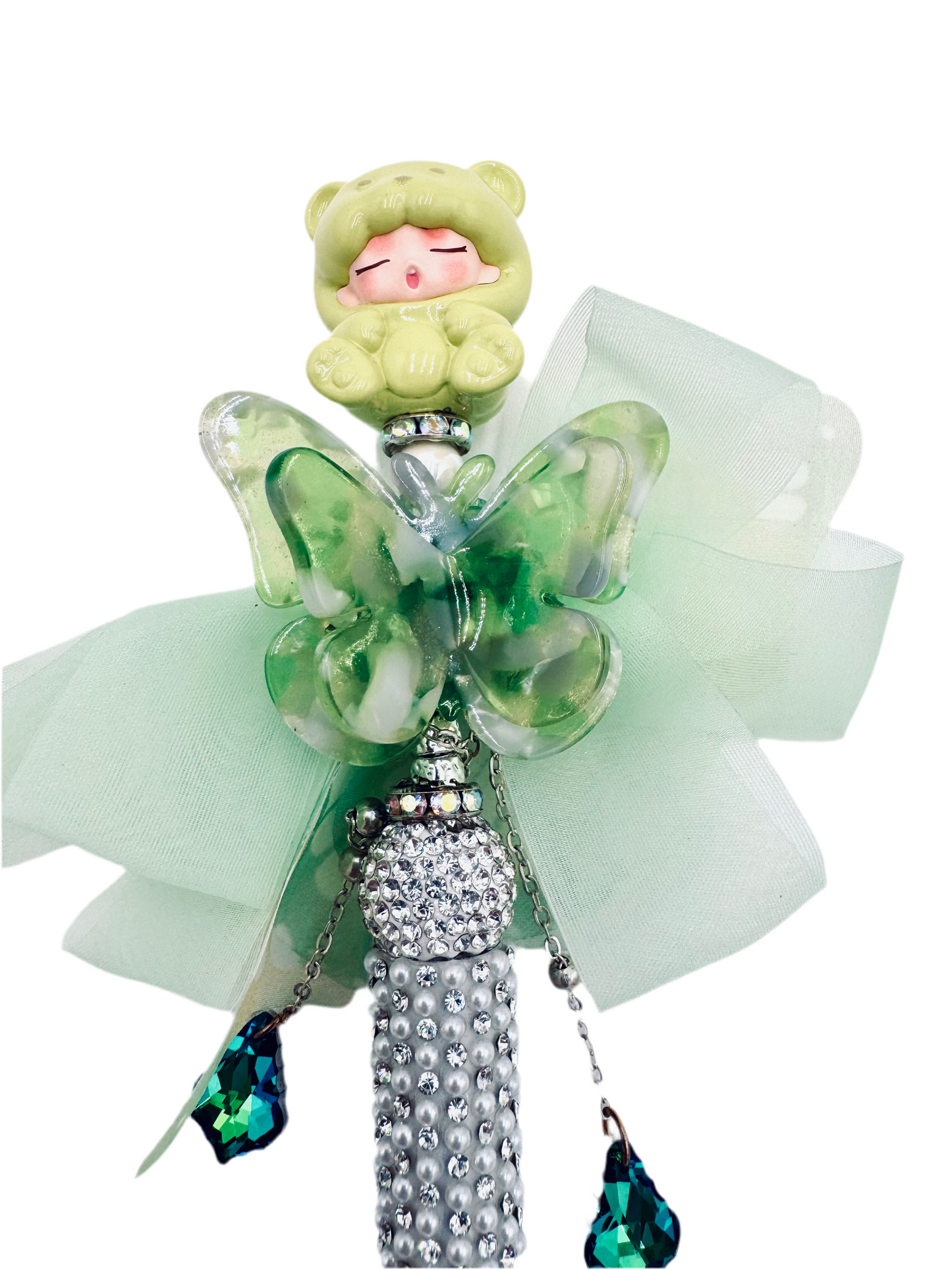 Green sleeping baby with butterfly charmed pen
