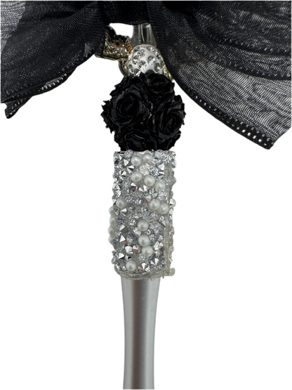 Elegant black bow with silver spinner, charmed pen.