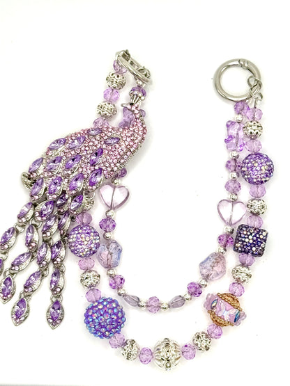 Purple peacock charmed phone chain.