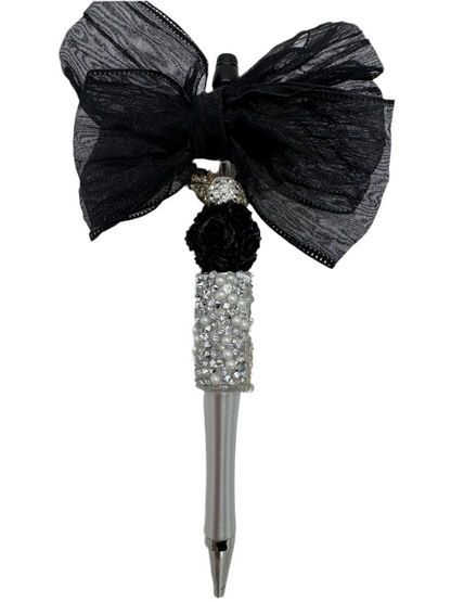 Elegant black bow with silver spinner, charmed pen.