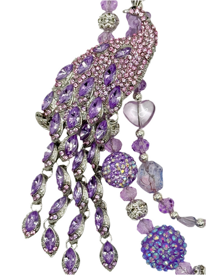Purple peacock charmed phone chain.
